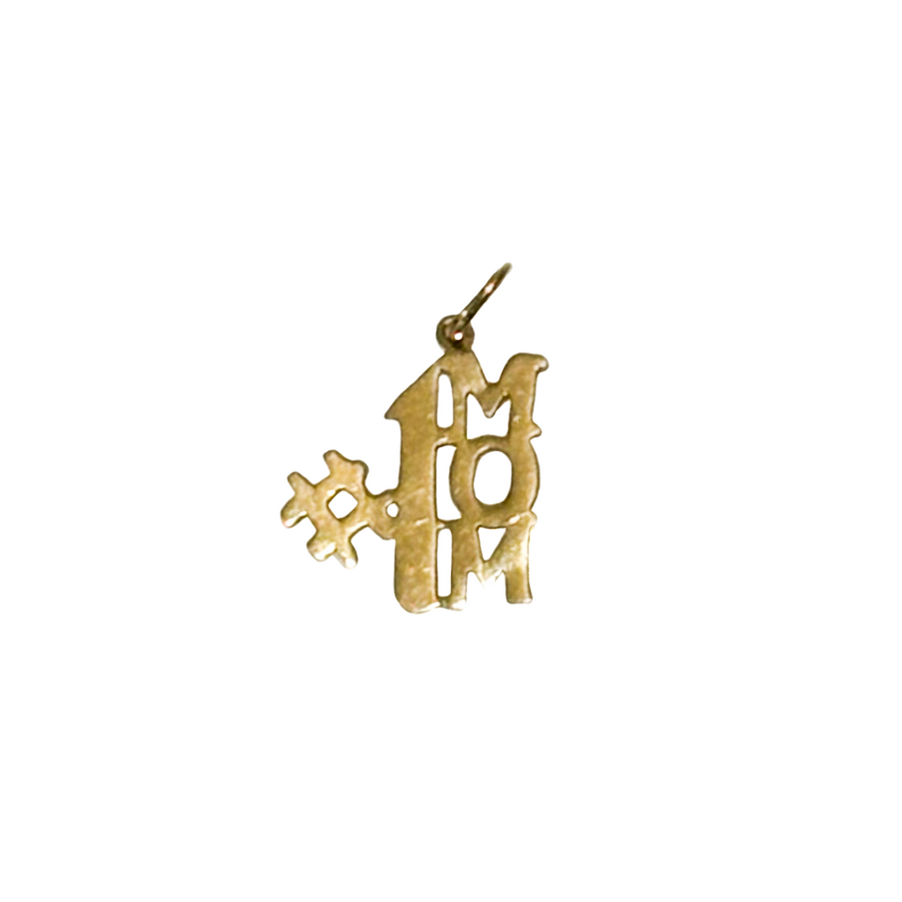 A 14k gold charm in the shape of the phrase '#1 Mom'